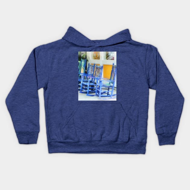 Row of Blue Rocking Chairs Kids Hoodie by SusanSavad